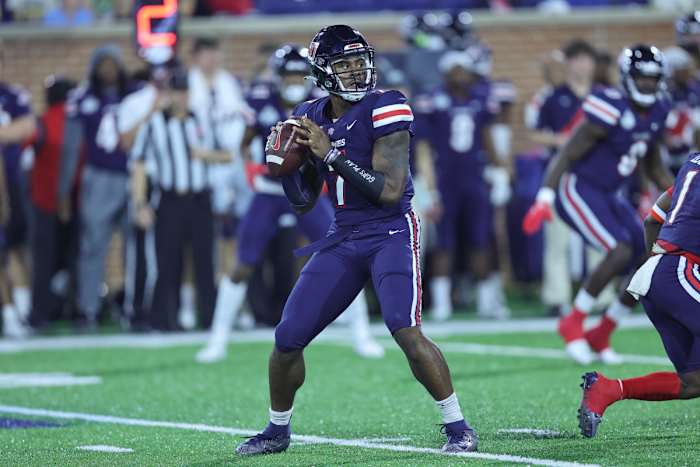 Dec 18, 2021; Mobile, Alabama, USA; Liberty Flames quarterback Malik Willis (7) sets up to pass in the first quarter against Eastern Michigan Eagles during the 2021 LendingTree Bowl at Hancock Whitney Stadium. Mandatory Credit: Robert McDuffie-USA TODAY Sports